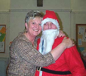 Carol Brookhouse making sure to keep Father Christmas happy.